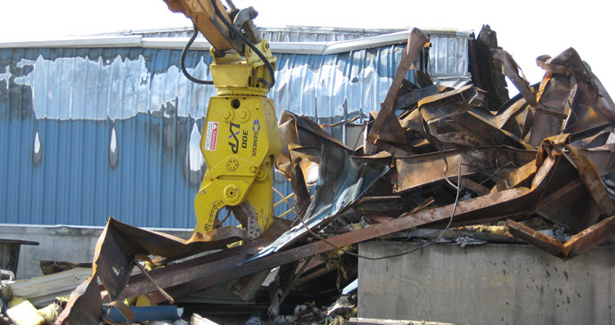 Genesis LXP 300 Shear Jaw working in demolition application