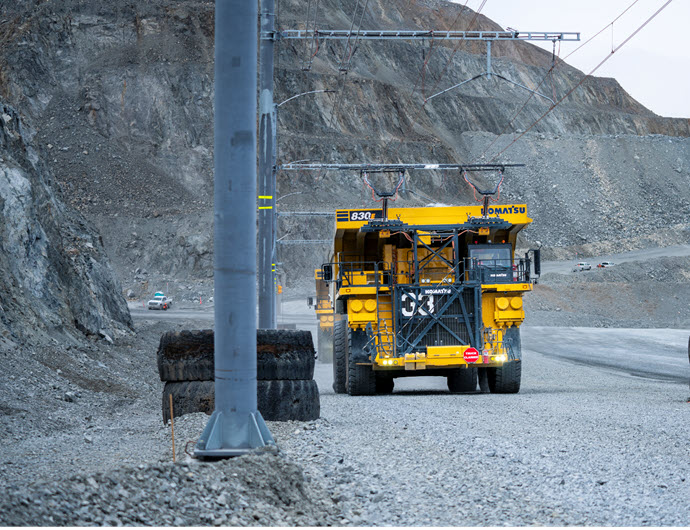 What advantages does trolley assist provide compared to traditional diesel?