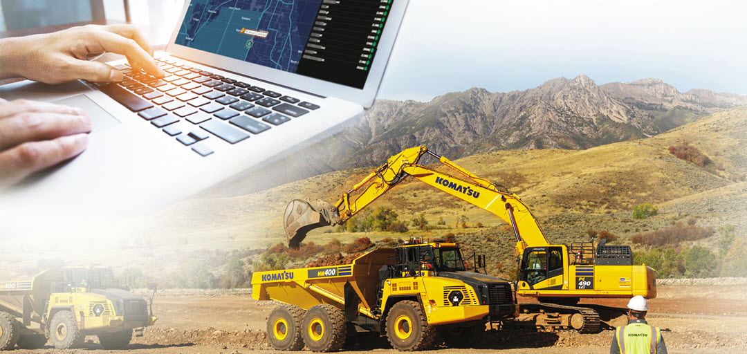 excavator and articulated truck working with data being sent to computer